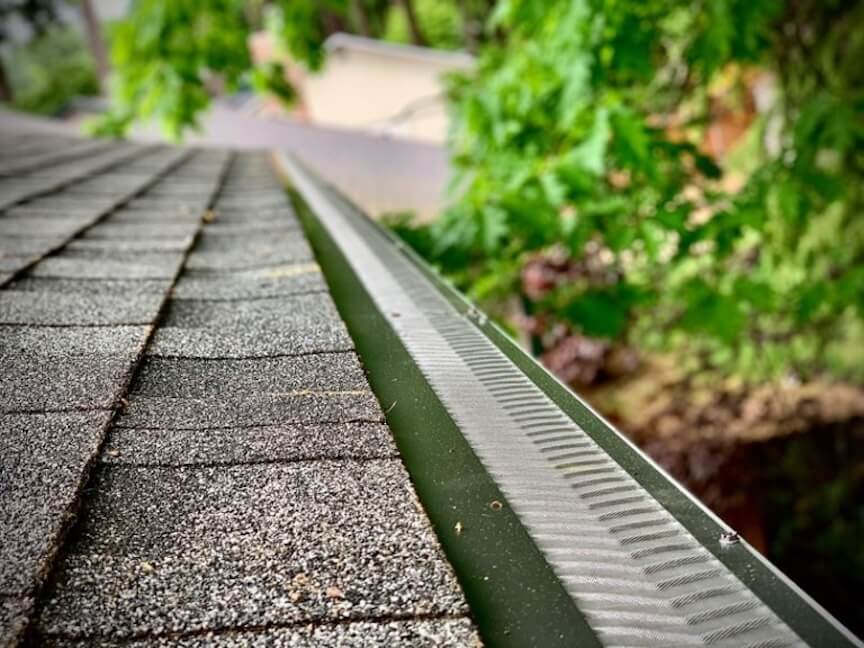 A graphic comparing different types of gutter guards side-by-side